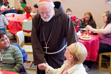 Cardinal Seán P. O’Malley visits Boston’s Pine Street Inn Dec. 24, 2011. Pilot photo/ Christopher S. Pineo