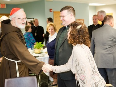 Luncheon with the newly ordained priests and their families at the archdiocese's Pastoral Center, May 29, 2013.
Pilot photo by Gregory L. Tracy