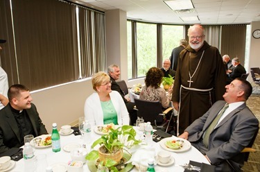 Luncheon with the newly ordained priests and their families at the archdiocese's Pastoral Center, May 29, 2013.
Pilot photo by Gregory L. Tracy