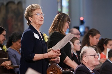 Cardinal Seán P. O'Malley presents the 2014 Cheverus Award Medals for service to the Church to 116 recipients at a Vespers Service at the Cathedral of the Holy Cross Nov. 23, 2014. Afterward, the cardinal joined the recipients and their families at a reception in neighboring Cathedral High School.<br />
Pilot photo/ Gregory L. Tracy<br />
