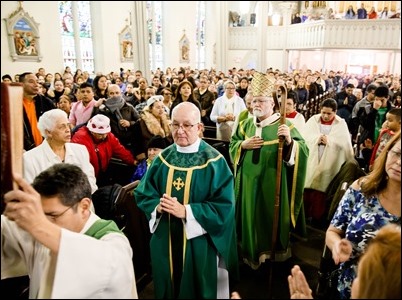 Cardinal Seán P. O'Malley celebrates Mass at Most Holy Redeemer Parish in East Boston Sunday, Feb. 5, 2017. Before the Mass the cardinal, Boston Mayor Martin Walsh and Police Commissioner William Evans addressed the congregation expressing support for the city’s immigrant community. Pilot photo/ Gregory L. Tracy 