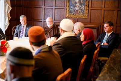 Gov. Charlie Baker, Cardinal Sean O’Malley and Boston Mayor Martin Walsh listen to remarks by  Imam Yasir Fahmy of the Islamic Society of Boston Cultural Center at a gathering hosted by Cardinal O’Malley to bring Boston-area Muslim community leaders together with representatives of the local Catholic and Greek Orthodox Churches and government officials, including Gov. Baker, Mayor Walsh and Boston Police Commissioner William Evans, at the rectory of the Cathedral of the Holy Cross Feb. 2, 2017.
Pilot photo/ Gregory L. Tracy 

