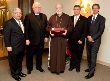 Presentation of the polyglot bible to Cardinal Seán P. O’Malley by representatives of the American Bible Society in the chapel of the Archdiocese of Boston’s Pastoral Center Jan. 13, 2009.<br /> Pilot photo/ Gregory L. Tracy