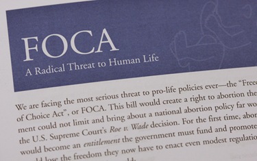 A close-up view shows literature used in a campaign against the Freedom of Choice Act at the office of the National Committee for a Human Life Amendment in Washington Jan. 26. Staff in the office were shipping boxes of postcards to dioceses and others as part of a national campaign against FOCA. (CNS photo/Paul Haring) (Jan. 26, 2009) See POSTCARDS Jan. 23, 2009.