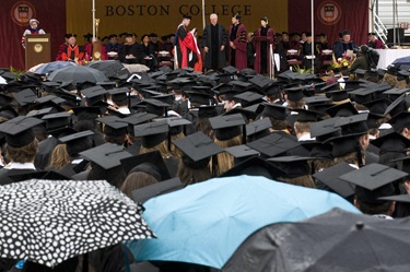 Daniel J. Harrington, SJ stands on stage about to receive his degree of Doctor of Humane Letters at the Boston College 2009 commencement exercises on M 5/18. Photo Lee Pellegrini