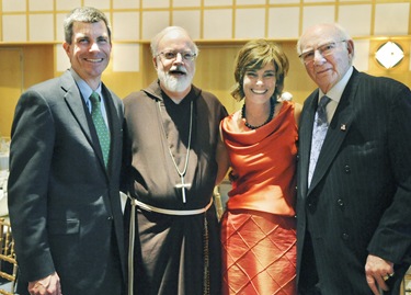 From left, Jeffrey Kaneb, chair of the Board of Trustees of Catholic Charites, Cardinal Sean P. O'Malley, Tiziana Dearing, president of Catholic Charities and A. Raymond Tye, president of The Ray Tye Medical Aid Foundation and Chairman Emeritus of United Liquors Ltd., pose following a Catholic Charities Spring Celebration 2009 at the John F. Kennedy Presidential Library and Museum, Thursday, May 21, 2009 in Boston. Tye was awarded the 2009 Justice and Compassion Award. (Photo/Lisa Poole)