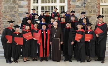 Cardinal Sean P. O'Malley, graduates and others pose following commencement of Master of Arts in Ministry at St. John's Chapel at St. John's Seminary, Wednesday, May 20, 2009 in Brighton, Mass. (Photo by Lisa Poole)