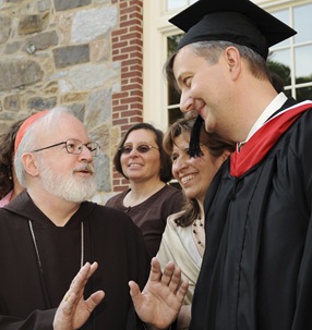 Cardinal Sean P. O'Malley speaks to graduate Andreas Widmer following commencement of Master of Arts in Ministry at St. John's Chapel at St. John's Seminary, Wednesday, May 20, 2009 in Brighton, Mass. (Photo by Lisa Poole)