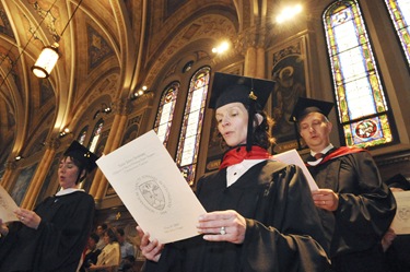 Graduates including Ellen Oesterle, front, and student speaker Andreas Widmer, back right, participate in the commencement of Master of Arts in Ministry at St. John's Chapel at St. John's Seminary, Wednesday, May 20, 2009 in Brighton, Mass. (Photo by Lisa Poole)