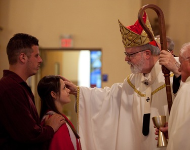 Cardinal Seán confirms the confirmation class at St. George Church in Framingham this past Sunday.
Photo by George Martell