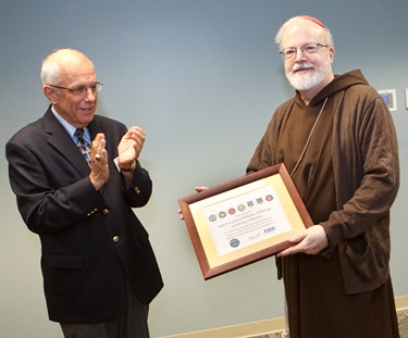 John Pelose, Area Chairman for Eastern Mass of Massachusetts Employer Support of the Guard and Reserve (ESGR), applauds Cardinal Seán P. O’Malley after presenting him with the Seven Seals Award. The Seven Seals Award is the highest state award given from the ESGR and is given in recognition of significant and enduring support of the Guard and Reserve.
Pilot photo/ Gregory L. Tracy
