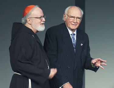 Cardinal Sean P. O'Malley is seen with A. Raymond Tye, president of The Ray Tye Medical Aid Foundation and Chairman Emeritus of United Liquors Ltd., before Tye took the podium during the Spring Celebration 2009 at the John F. Kennedy Presidential Library and Museum, Thursday, May 21, 2009 in Boston. Tye was awarded the 2009 Justice and Compassion Award. (Photo/Lisa Poole)