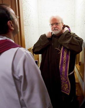 Cardinal Seán P. O’Malley prepares to hear confessions March 10, 2010 at Sacred Heart Church in East Boston as part of The Light Is On For You initiative. Pilot photo by Gregory L. Tracy