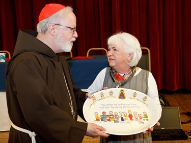 Lynn Kenn is honored for the 25th anniversary of the her founding of the archdiocese's Baby Showers program to help women in crisis pregancies. Pilot photo/ Gregory L. Tracy