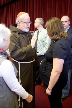 Lynn Kenn is honored for the 25th anniversary of the her founding of the archdiocese's Baby Showers program to help women in crisis pregancies. Pilot photo/ Gregory L. Tracy