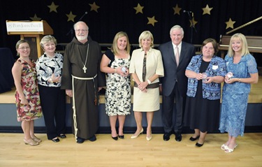 Cardinal Sean P. O'Malley and the Connors pose with award recipients following an awards night at the Pope John Paul II Catholic Academy in Dorchester, Wednesday, June 2, 2010. (Photo/Lisa Poole)