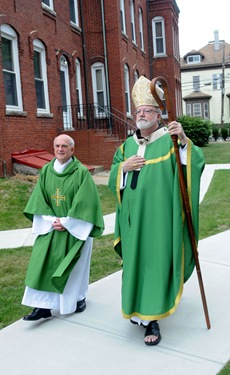 Amesbury, Cardinal Sean O'Malley walks with Deacon Ray Doucette before saying Mass at Holy Family Church in Amesbury Saturday afternoon. The cardinal was in Amesbury to  dedicate the new Parish Center at the church. Jim Vaiknoras/Staff photo