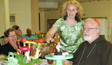 CJC_22 JEnnifer lighting birthday candle for Cardinal O'Malley Brockton 062710 ED-ed