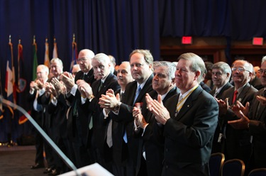 Members of the Supreme Board of Directors and other Knights of Columbus leaders give a standing ovation following the supreme knight’s annual report.