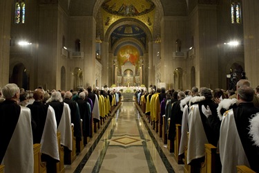 Fourth Degree Knights stand at the end of the pews, as thousands of Knights and their families participate in Mass at the Basilica of the National Shrine of the Immaculate Conception.