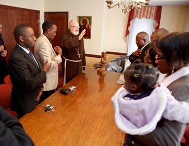 Visit by leader of the Ugandan Catholic community in Boston, March 13, 2011. Photo by Gregory L. Tracy/ The Pilot