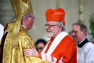 Cardinal Seán P. O'Malley, Archbishop of Boston,  greets Bishop Christopher J. Coyne, a former priest of the Archdiocese of Boston, during his ordination as the Auxiliary Bishop of Indianapolis at St. John the Evangelist Church in Indianapolis on Wednesday, March 2, 2011..CNS photo by Bob Nichols.