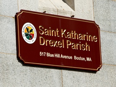 Employees from the acrhdiocese's Pastoral Center help clean and beautify St. Katharine Drexel Parish, May 25, 2011. Pilot photo by Gregory L. Tracy