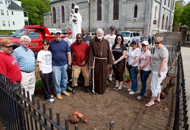 Employees from the acrhdiocese's Pastoral Center help clean and beautify St. Katharine Drexel Parish, May 25, 2011. Pilot photo by Gregory L. Tracy