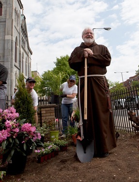 Employees from the acrhdiocese's Pastoral Center help clean and beautify St. Katharine Drexel Parish, May 25, 2011. Pilot photo by Gregory L. Tracy