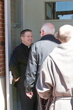 Priests gather for the annual Chrism Mass luncheon at Cathedral High following the Mass.  Fathers James Rafferty and Louis Palmieri were recognized for their service during the lunch. Pilot photo by Gregory L. Tracy 