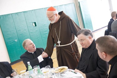 Priests gather for the annual Chrism Mass luncheon at Cathedral High following the Mass.  Fathers James Rafferty and Louis Palmieri were recognized for their service during the lunch. Pilot photo by Gregory L. Tracy 