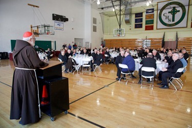 Priests gather for the annual Chrism Mass luncheon at Cathedral High following the Mass.  Fathers James Rafferty and Louis Palmieri were recognized for their service during the lunch. Pilot photo by Gregory L. Tracy 