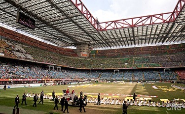 Pope Benedict XVI, flanked by Milan Cardinal Angelo Scola, waves as they arrive at San Siro stadium in Milan June 2. The pope was in Milan for the 2012 World Meeting of Families. (CNS photo/Maria Grazia Picciarella, pool) (June 4, 2012) See stories marked FAMILIES- June 1-4, 2012.
