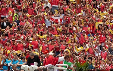 Pope Benedict XVI, flanked by Milan Cardinal Angelo Scola, waves as they arrive at San Siro stadium in Milan June 2. The pope was in Milan for the 2012 World Meeting of Families. (CNS photo/Maria Grazia Picciarella, pool) (June 4, 2012) See stories marked FAMILIES- June 1-4, 2012.
