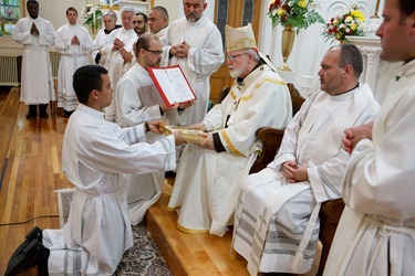 Cardinal Sean P. O'Malley institues lectors and acolytes of Redemptoris Mater Seminary June 9, 2012 at Our Lady of the Assumption Church in East Boston. Photo by Gregory L. Tracy