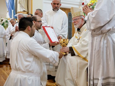 Cardinal Sean P. O'Malley institues lectors and acolytes of Redemptoris Mater Seminary June 9, 2012 at Our Lady of the Assumption Church in East Boston. Photo by Gregory L. Tracy