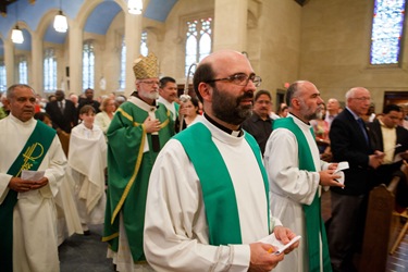 Father Carlos Flor is installed as pastor of St. Thomas Aquinas Parish and Our Lady of Lourdes Parish in Jamaica Plain, and St. Mary of the Angels Parish in Roxbury, at Our Lady of Lourdes Church Sept. 22, 2012. 
Photo by Gregory L. Tracy, The Pilot