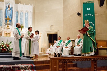 Father Carlos Flor is installed as pastor of St. Thomas Aquinas Parish and Our Lady of Lourdes Parish in Jamaica Plain, and St. Mary of the Angels Parish in Roxbury, at Our Lady of Lourdes Church Sept. 22, 2012. 
Photo by Gregory L. Tracy, The Pilot