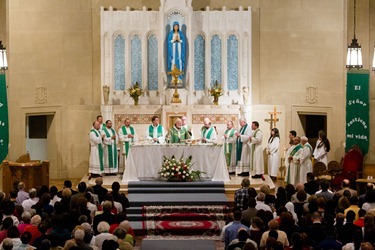 Father Carlos Flor is installed as pastor of St. Thomas Aquinas Parish and Our Lady of Lourdes Parish in Jamaica Plain, and St. Mary of the Angels Parish in Roxbury, at Our Lady of Lourdes Church Sept. 22, 2012. 
Photo by Gregory L. Tracy, The Pilot