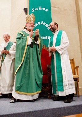 Father Carlos Flor is installed as pastor of St. Thomas Aquinas Parish and Our Lady of Lourdes Parish in Jamaica Plain, and St. Mary of the Angels Parish in Roxbury, at Our Lady of Lourdes Church Sept. 22, 2012. 
Photo by Gregory L. Tracy, The Pilot