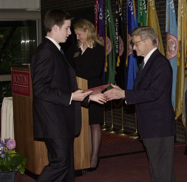 Michael D. Dewey, of the  Catholic Memorial High School,   shakes hands with Dr. Silber and Bishop Lennon, as he is presented with his scholarship.                            