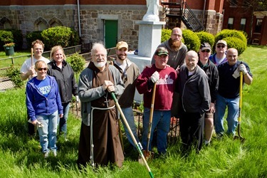 Cardinal Sean P. O’Malley joins archdiocesan employees working to beautify St. Patrick Church in Roxbury as part of Parish Service Week, May 13, 2013. After the spring cleaning, Cardinal Sean visited St. Patrick School spending time with students and with the classmates of Barry Brinson, a 7th grade student at the school who was killed May 9 in a traffic accident in Allston.
Pilot photo by Gregory L. Tracy
