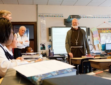 Cardinal Sean P. O’Malley joins archdiocesan employees working to beautify St. Patrick Church in Roxbury as part of Parish Service Week, May 13, 2013. After the spring cleaning, Cardinal Sean visited St. Patrick School spending time with students and with the classmates of Barry Brinson, a 7th grade student at the school who was killed May 9 in a traffic accident in Allston.
Pilot photo by Gregory L. Tracy
