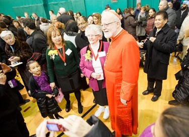 Cardinal Seán P. O'Malley greets Cheverus Award recipients and their guests at a reception at Cathedral High School following the Nov. 24, 2013 Cheverus Award ceremony.
Pilot photo/ Gregory L. Tracy 
