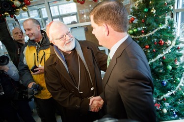 Cardinal Seán P. O'Malley, Boston Mayor-elect Marty Walsh and Sen. Edward Markey serve meals at Pine Street Inn Dec. 24, 2013. Pilot photo by Gregory L. Tracy