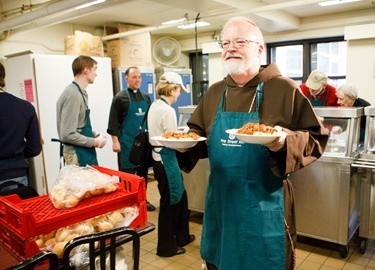 Cardinal Seán P. O'Malley, Boston Mayor-elect Marty Walsh and Sen. Edward Markey serve meals at Pine Street Inn Dec. 24, 2013. Pilot photo by Gregory L. Tracy