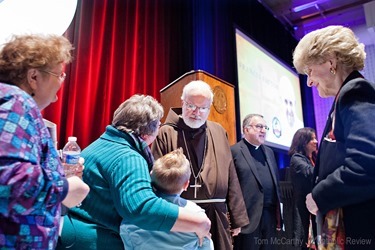 TOM McCARTHY JR. | CR STAFF
Cardinal Seán P. O’Malley, a Capuchin Franciscan and archbishop of Boston, talks with seven-year-old Camden Jones following The Francis Factor at Loyola Univiersity March 18, hosted by the Archdiocese of Baltimore as part of its 225th anniversary celebration. 