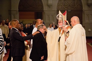 Easter Vigil, celebrated at the Cathedral of the Holy Cross April 19, 2014. Pilot photo/ Christopher S. Pineo 