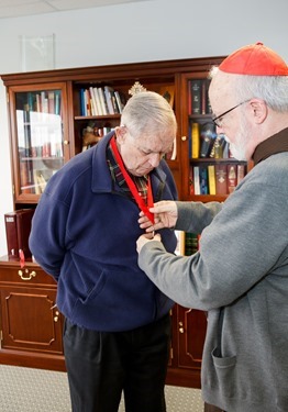 John McNeice receives his Cheverus Award from Cardinal Seán P. O'Malley Apri 8, 2014. Pilot photo/ Gregory L. Tracy