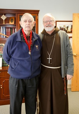 John McNeice receives his Cheverus Award from Cardinal Seán P. O'Malley Apri 8, 2014. Pilot photo/ Gregory L. Tracy